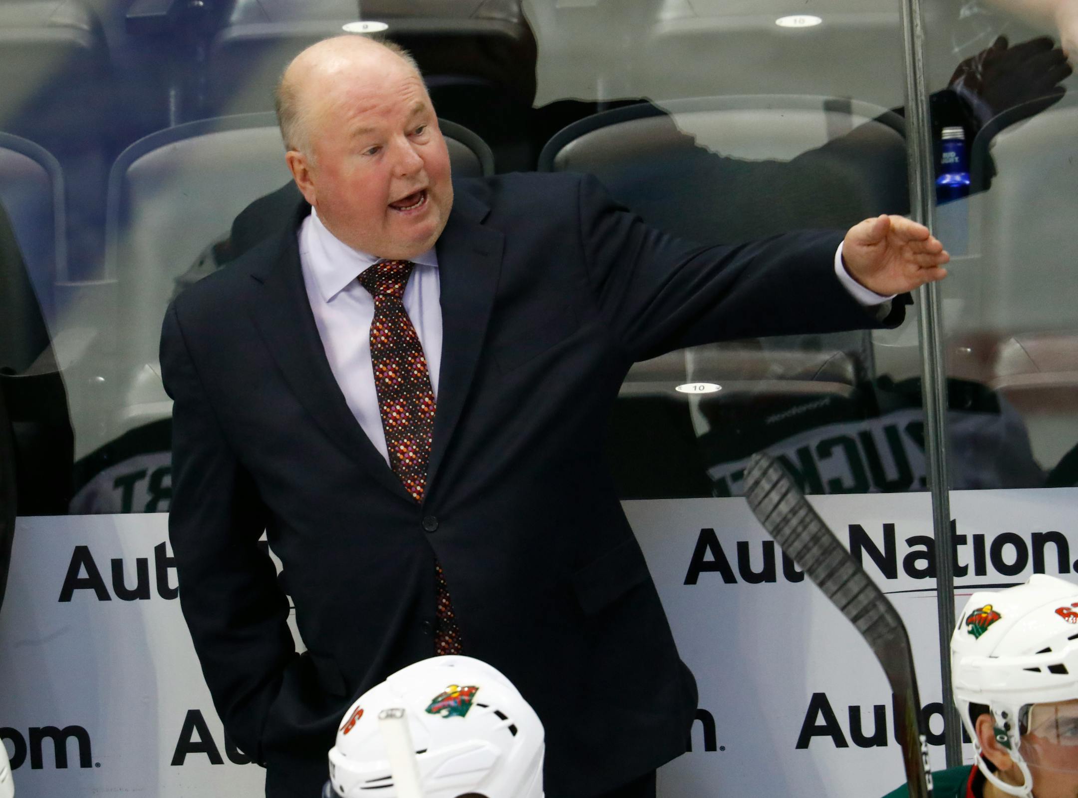 Minnesota Wild head coach Bruce Boudreau directs his players against the Colorado Avalanche in the second period of an NHL preseason hockey game Tuesday, Oct. 4, 2016, in Denver. (AP Photo/David Zalubowski)