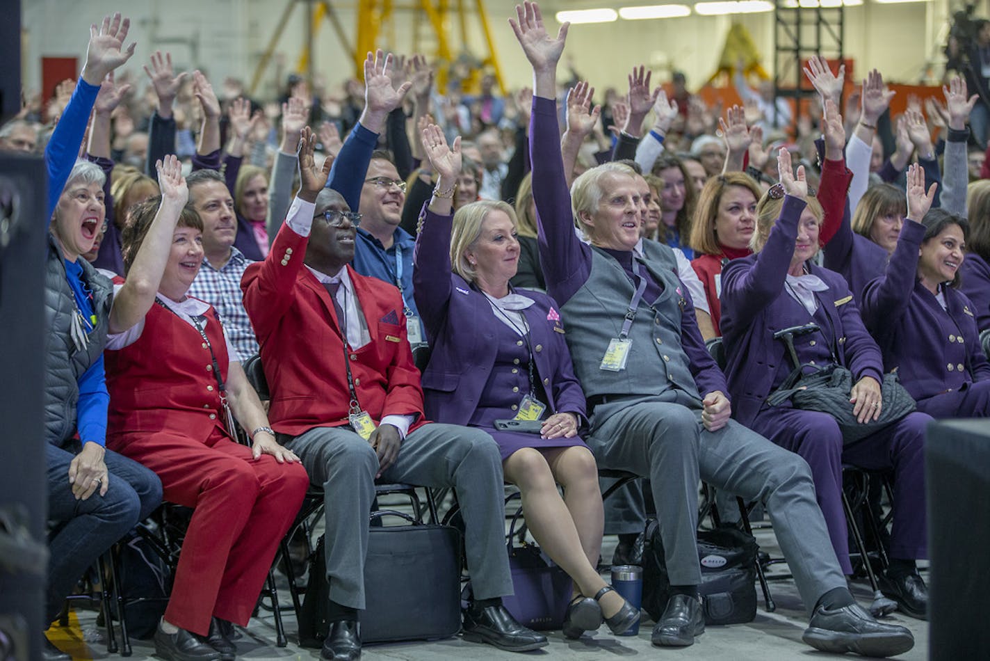 Delta Air Lines employees raised their hands if they worked more than 10 years as they celebrated its 10-year anniversary of the Northwest merger (the U.S. DOJ officially approved the merger Oct. 29, 2008) during a party at the MSP hangar, Monday, October 29, 2018 in Bloomington, MN. About 600 employees showed up for a live stream connecting Minneapolis and Atlanta hangar parties through a large screen led by CEO of Delta Air Lines, Ed Bastian in Atlanta. ] ELIZABETH FLORES &#x2022; liz.flores@s