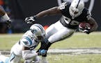 Carolina Panthers cornerback Daryl Worley (26) tackles Oakland Raiders running back Latavius Murray (28) during the first half of an NFL football game