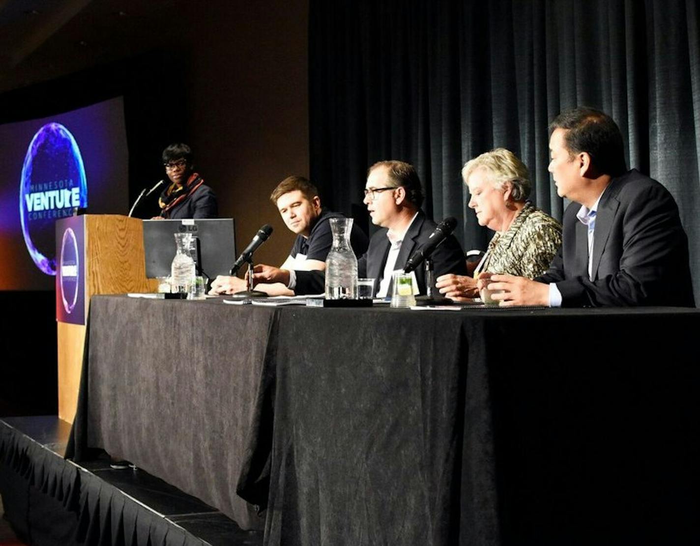 Commissioner Shawntera Hardy of the Minnesota Department of Employment and Economic Development talks with technology company leaders at the annual venture conference of the Minnesota High Technology Associaton last fall. They are (left to right) Lou DiLorenzo of Bright Health, Clay Collins of Leadpages, Lee Jones of Rebiotix and Matt Matsui of Calabrio. Minnesota companies raised nearly $500 million in venture capital in 2017.