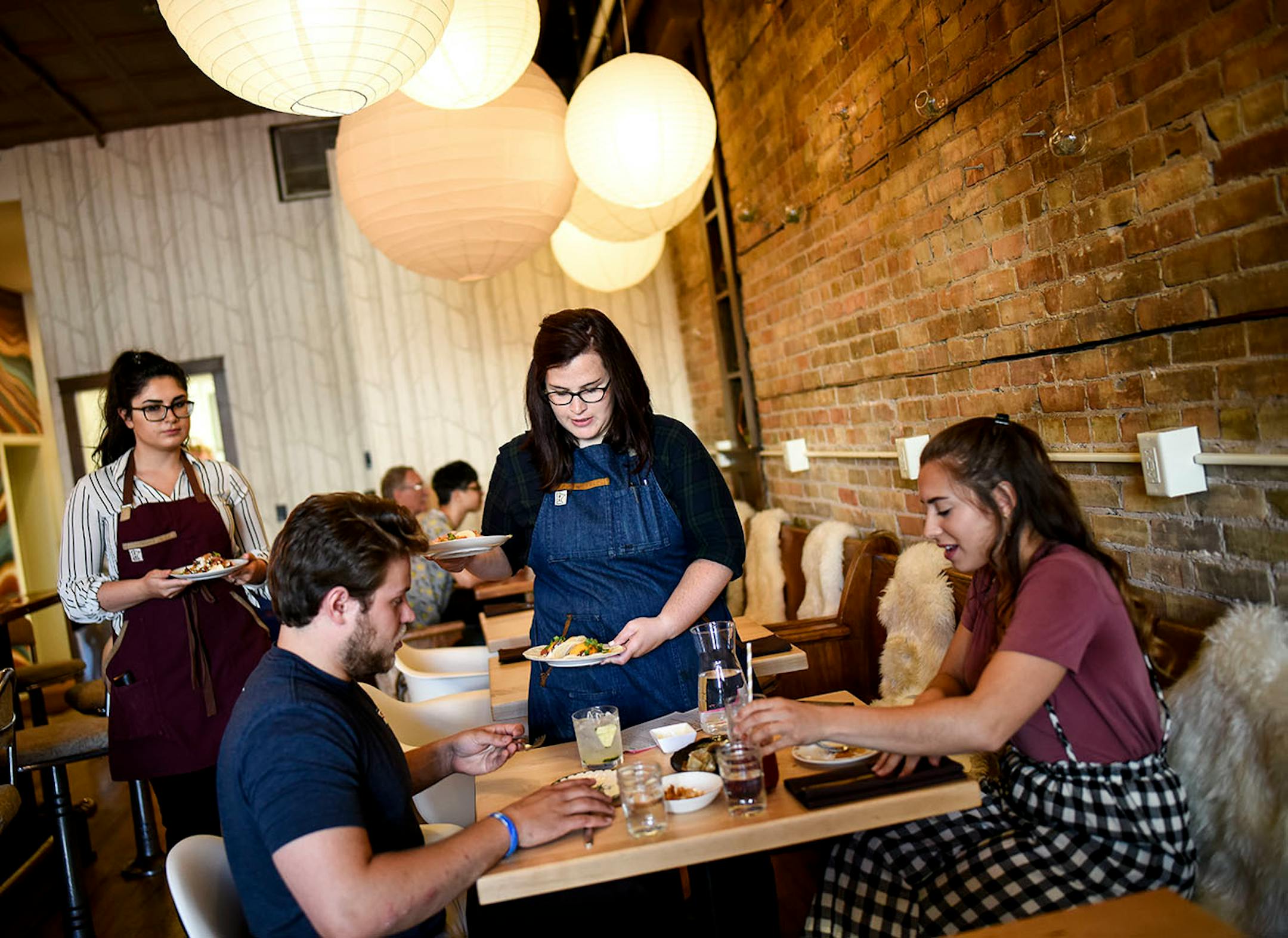 Martha's Daughter server Jolene Prochazka served an assortment of tacos to Ryan Ebhardt and Heather Schultz, of Duluth, Wednesday night during dinner hours.