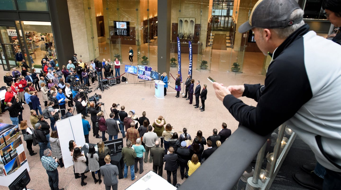 A press conference and event marking 100 days until Super Bowl LII here in Minneapolis was held in the IDS Crystal Court with an ice sculpture outside.