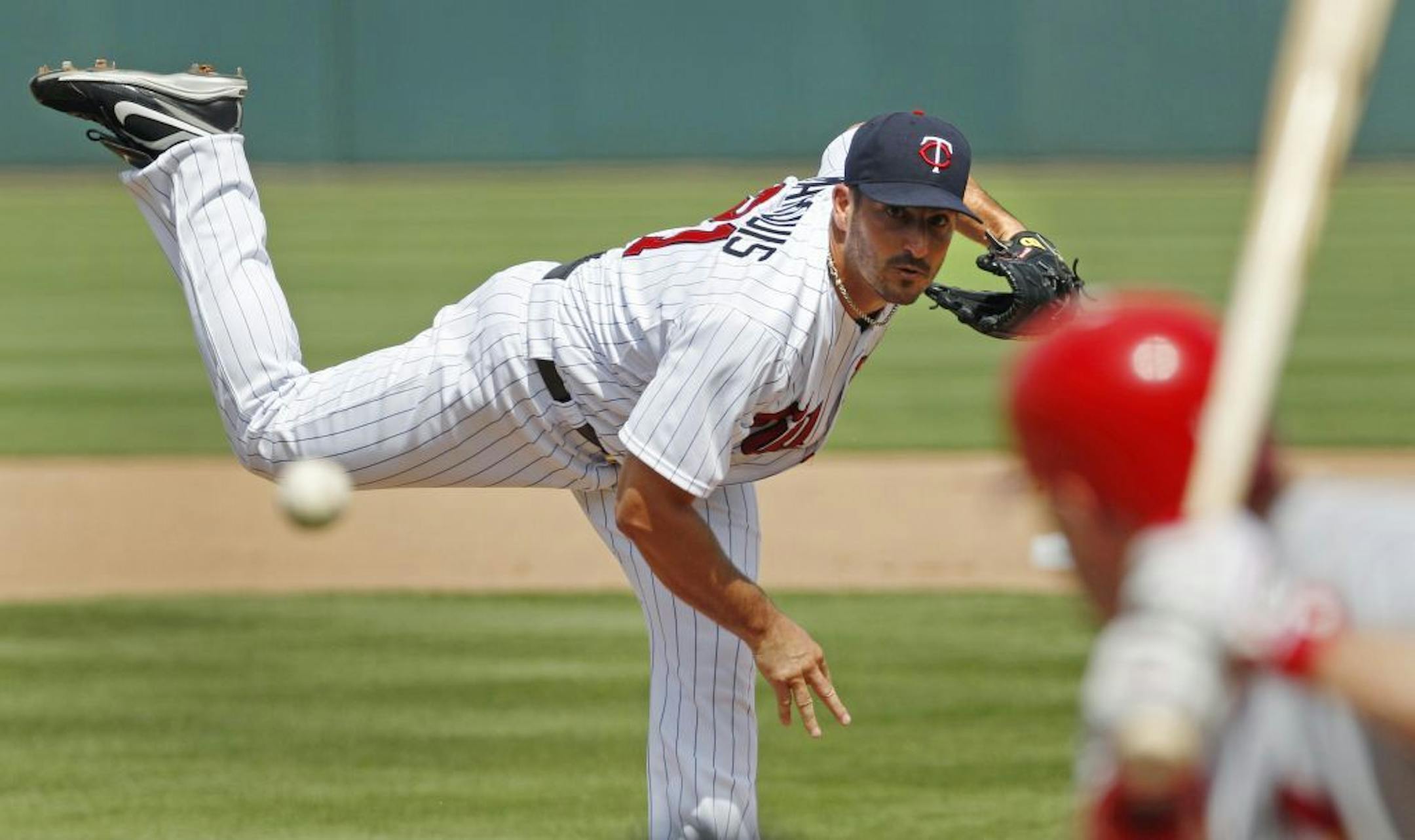 Minnesota Twins starter Jason Marquis delivers to St. Louis Cardinals' John Jay during the first inning of a spring training baseball game in Fort Myers, Fla., Friday, March 9, 2012.