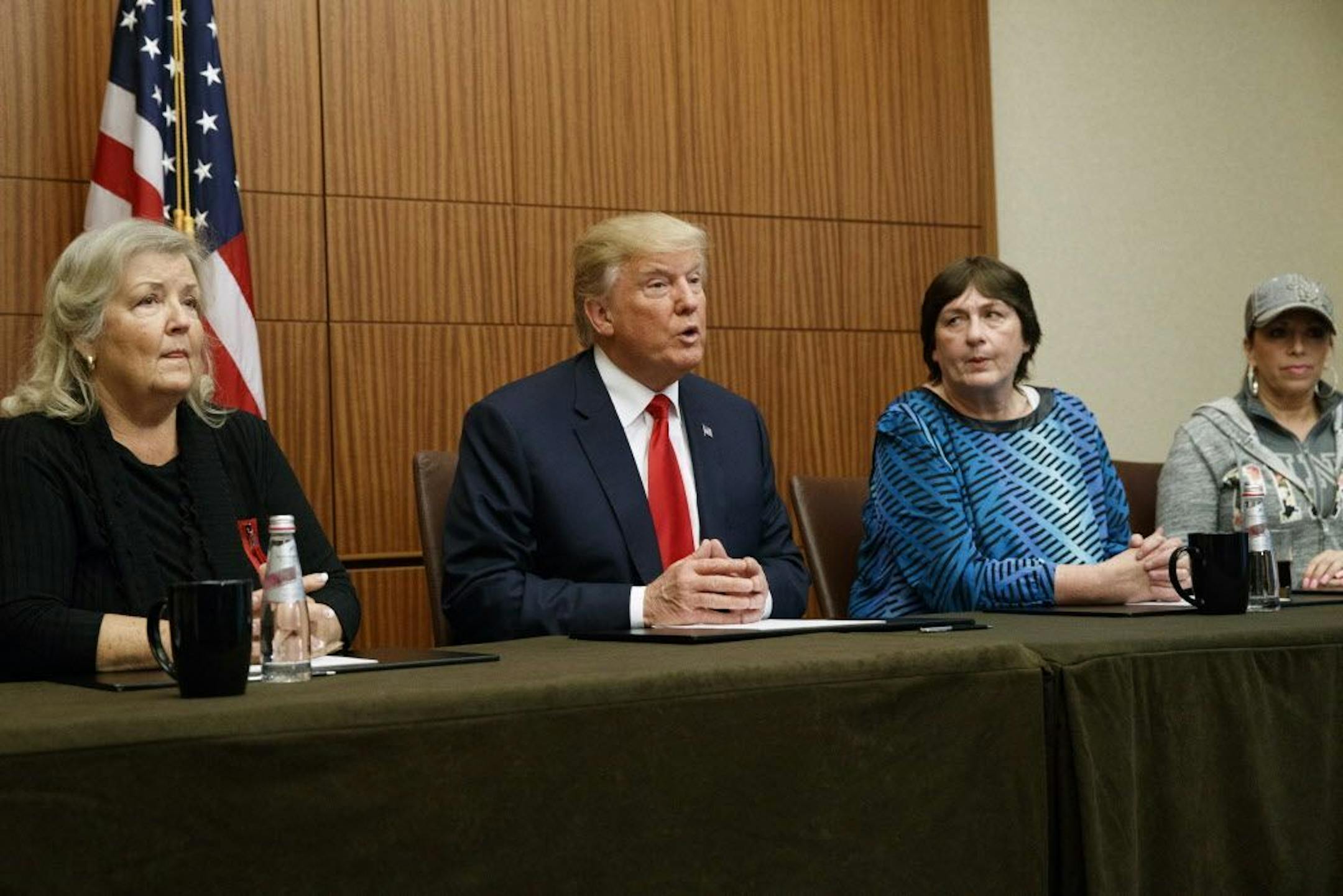 Republican presidential candidate Donald Trump makes remarks before the second presidential debate with Democratic presidential candidate Hillary Clinton, Sunday, Oct. 9, 2016, in St. Louis. From right, Paula Jones, Kathy Shelton, Trump, and Juanita Broaddrick.