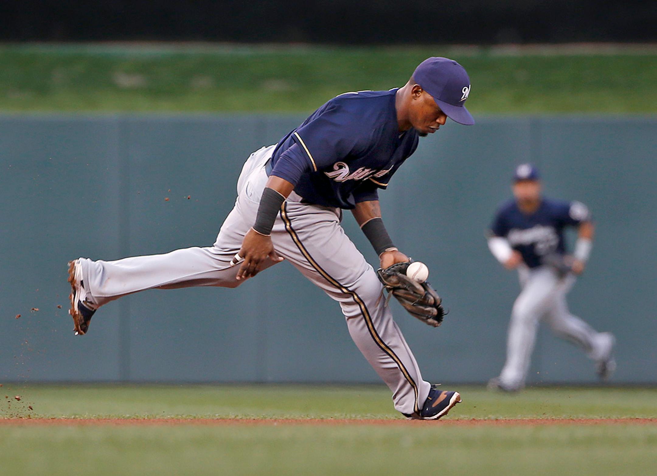 Jean Segura of the Brewers bobbled the ball but still got the out at second during the fourth inning.