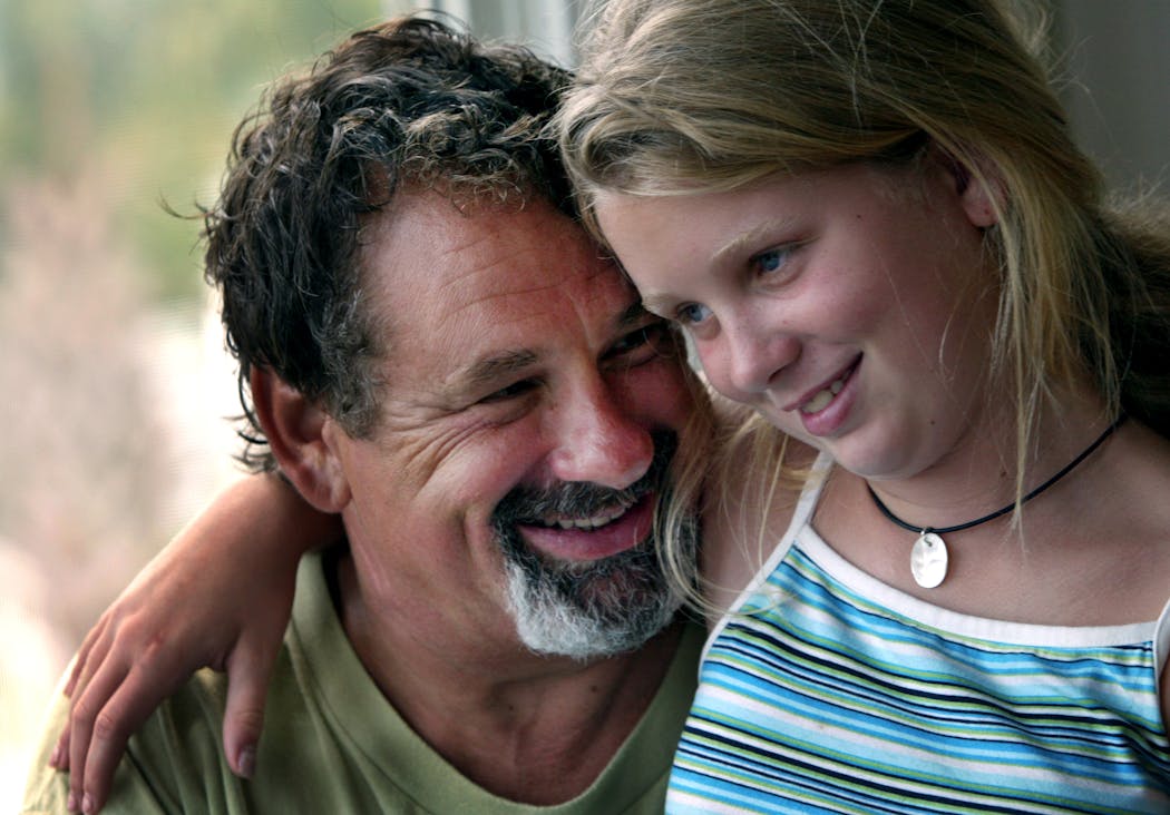 Mike Veeck and his daughter, Rebecca, then 11. shared a moment together in 2003 at their home in South Carolina.