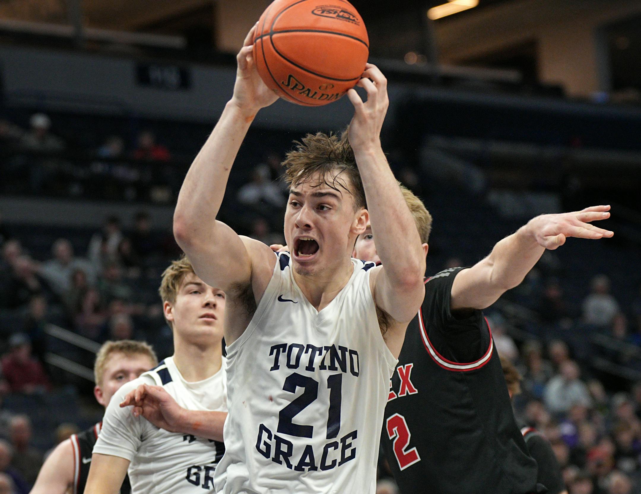 Totino-Grace's Patrick Bath pulled down a rebound against Alexandria.