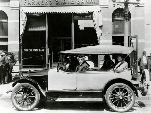 An unidentified group rode in a car built by Pan Motor Co. in downtown St. Cloud in 1918.