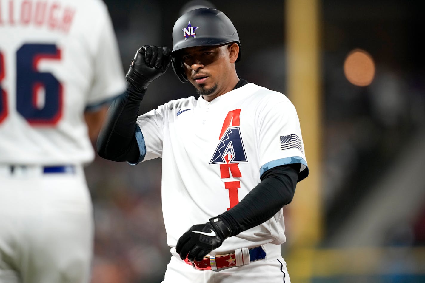 National League's Eduardo Escobar, of the Arizona Diamondbacks, adjusts his helmet after a base hit during the eighth inning of the MLB All-Star baseball game, Tuesday, July 13, 2021, in Denver. (AP Photo/David Zalubowski)