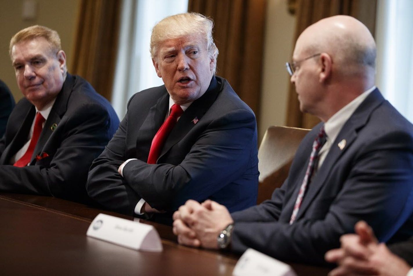 President Donald Trump speaks during a meeting with steel and aluminum executives in the Cabinet Room of the White House, Thursday, March 1, 2018, in Washington. From left, John Ferriola of Nucor, Trump, and Dave Burritt of U.S. Steel Corporation.