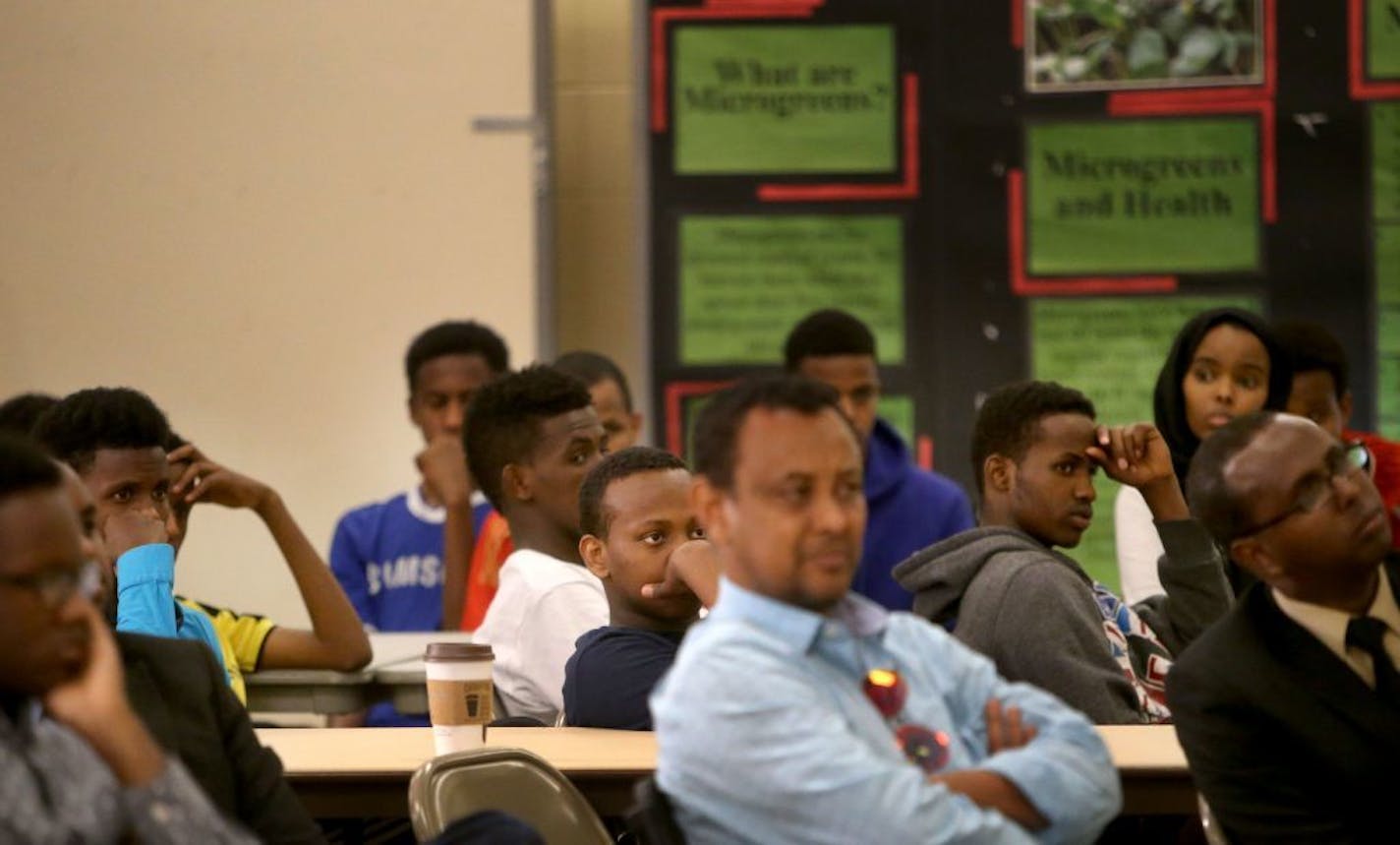 Young people, including some youth members of a Phillip's Community Center soccer team, listen to local FBI members during a town hall meeting with members of the Somali community about the recent charges against six men accused of trying to join ISIL. The town hall meeting took place at the Phillip's Community Center Saturday, May 9, 2015, in Minneapolis, MN.