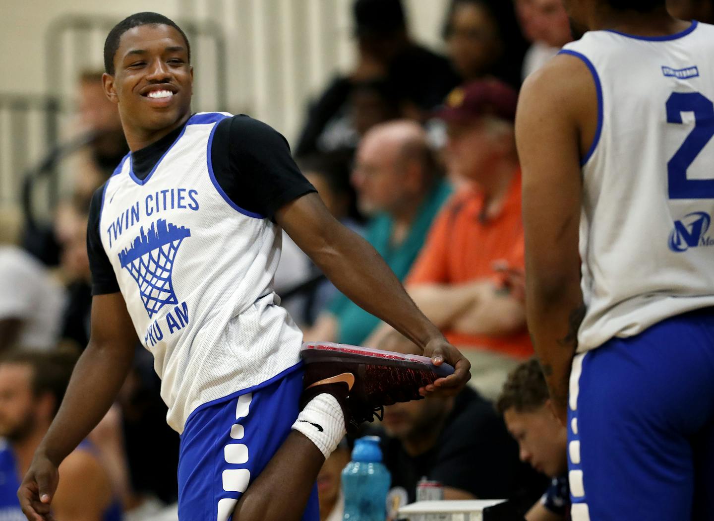 Gophers freshman Isaiah Washington stretched out before playing in a Twin Cities Pro Am game at DelaSalle High School. ] CARLOS GONZALEZ &#xef; cgonzalez@startribune.com - June 19, 2017, Minneapolis, MN, DelaSalle High School, Summer League Basketball, Twin Cities Pro Am opener