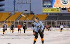 Philadelphia Flyers right wing Matt Read tosses a puck during practice on the outdoor hockey rink at Heinz Field in Pittsburgh on Friday, Feb. 24, 201