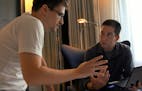 In this image released by Radius TWC, Edward Snowden, left, appears with Glenn Greenwald in a scene from "Citizenfour," a documentary that intimately 