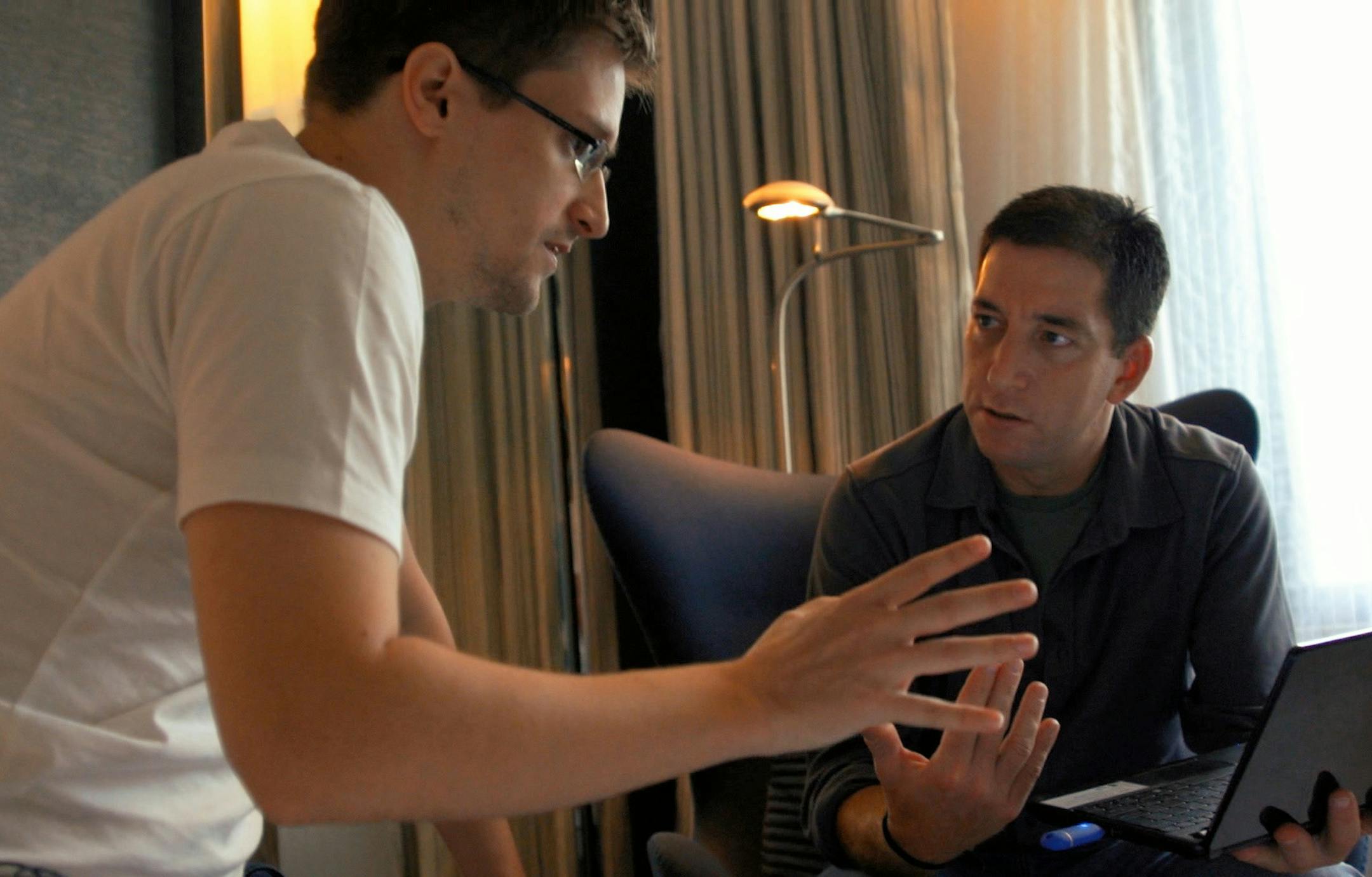 In this image released by Radius TWC, Edward Snowden, left, appears with Glenn Greenwald in a scene from "Citizenfour," a documentary that intimately captures Snowden during his leak of NSA documents. (AP Photo/Radius TWC) ORG XMIT: MIN2014103114240758
