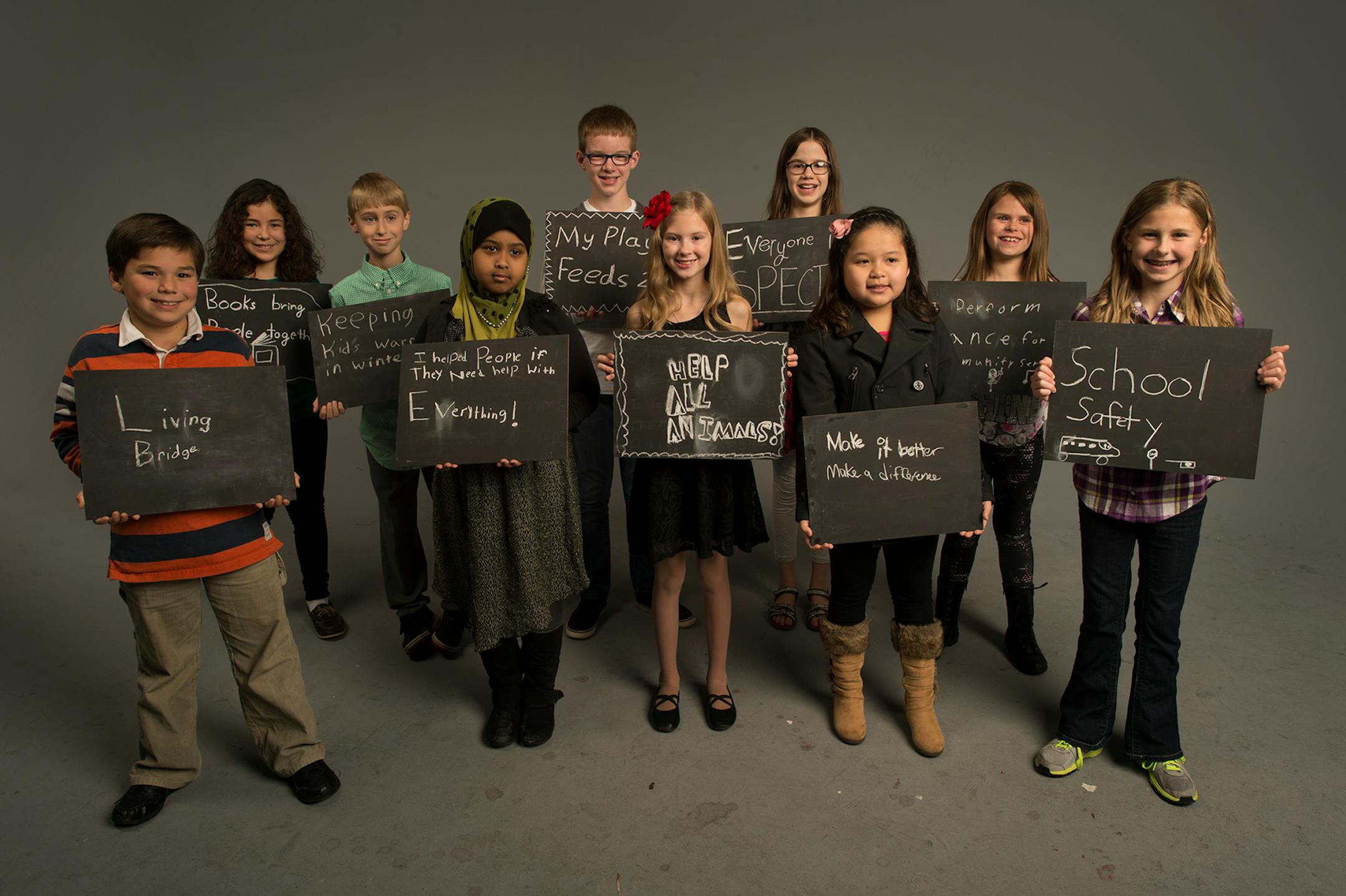 Students whose essays won the contest are pictured in 2014.