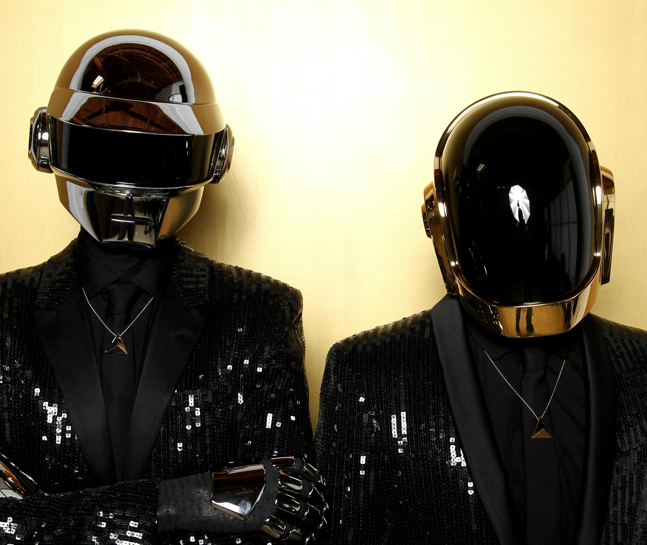 FILE - In this April 17, 2013 file photo, Thomas Bangalter, left, and Guy-Manuel de Homem-Christo, from the group Daft Punk pose for a portrait in Los Angeles. Daft Punk's single "Get Lucky" is one of the top songs of the summer. (Photo by Matt Sayles/Invision/AP, File)