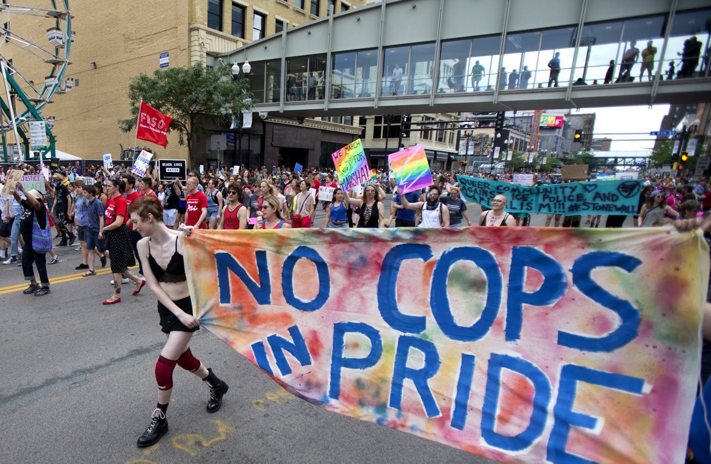 Protestors marched ahead of the pride parade on Sunday to call attention to misconduct by police and the death of black community members. ] ALEX KORMANN &#x2022; alex.kormann@startribune.com A few dozen protestors delayed the pride parade on Sunday. The protestors called for the removal of all police during the parade. They also chanted the names of numerous black community members who died in police shootings. The protestors marched down the same route of the parade to reach as large of an aud