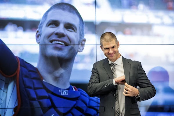 Twins' Joe Mauer took his seat at his retirement news conference. "I'm 100 percent behind the decision, and look forward to the next chapter in my lif