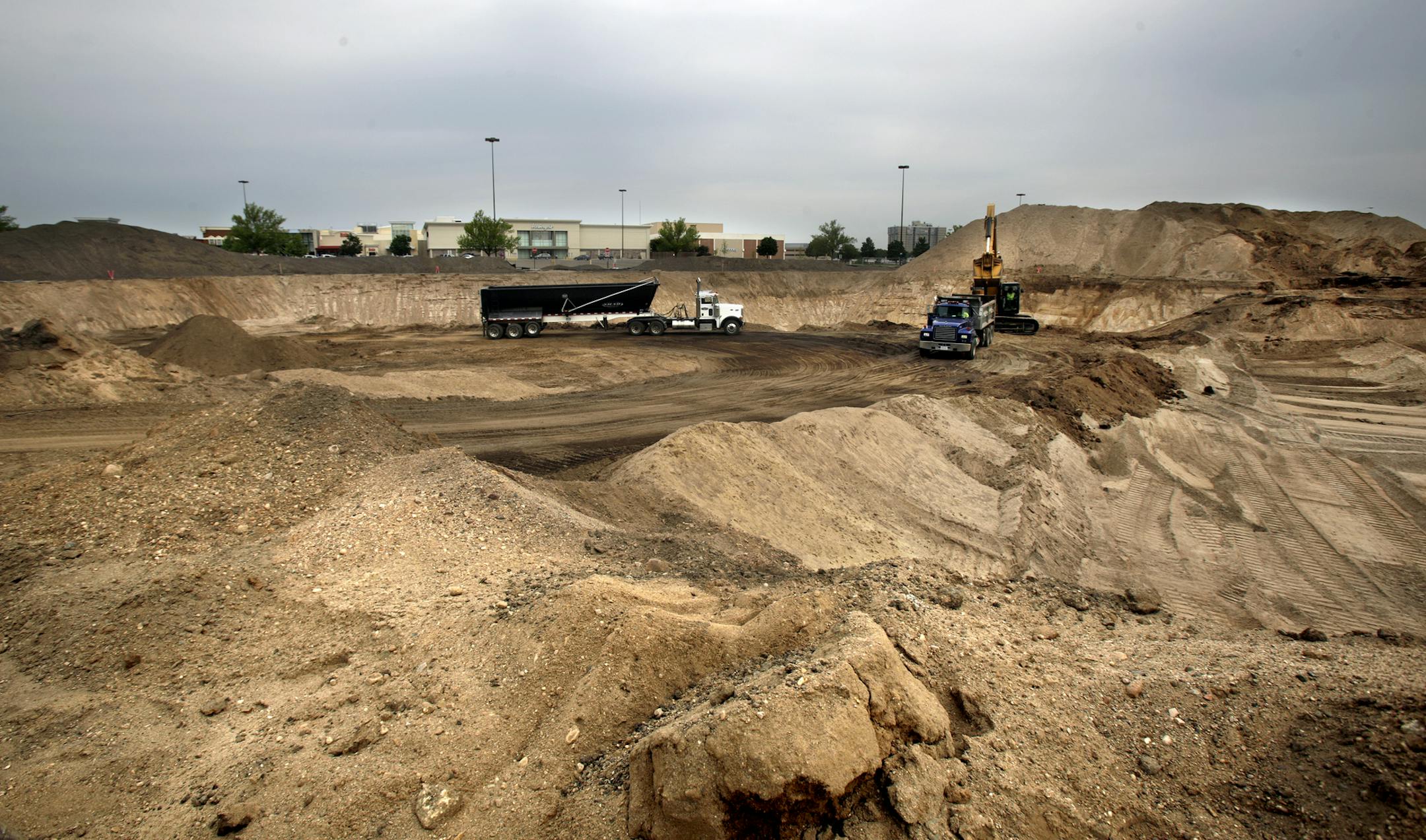 One Southdale Place is an apartment project under construction in Edina, in the parking lot of Southdale on July 31, 2013. ] JOELKOYAMA‚Ä¢joel koyama@startribune MAGIC SAXO NUMBER IS 598696 For years, shopping malls always seemed to be surrounded by parking -- and lots of it. But a unique apartment project at Southdale in Edina -- the nation's first enclosed shopping mall -- is challenging the 'sea of parking' paradigm. The mall teamed up with a local apartment developer to buil
