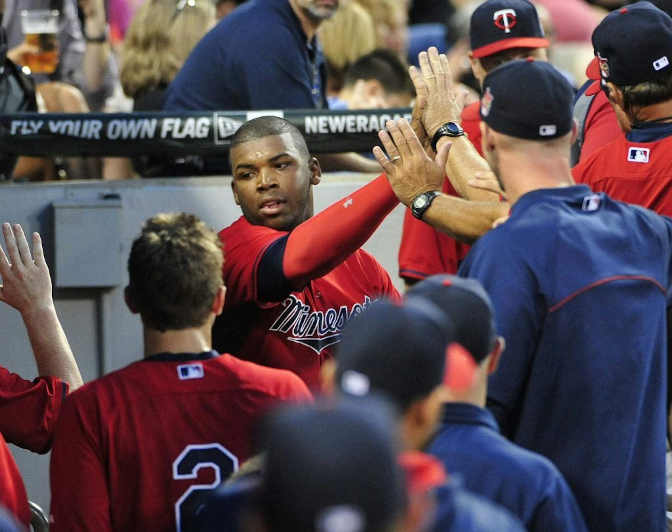 Twins rookie Kennys Vargas, center, was greeted after scoring in the third inning against the Chicago White Sox on Friday.