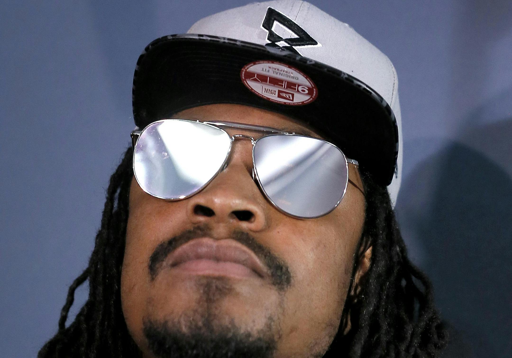 Seattle Seahawks' Marshawn Lynch looks away during a news conference for NFL Super Bowl XLIX football game, Wednesday, Jan. 28, 2015, in Phoenix. The Seahawks play the New England Patriots in Super Bowl XLIX on Sunday, Feb. 1, 2015. (AP Photo/Matt York) ORG XMIT: AZMY132