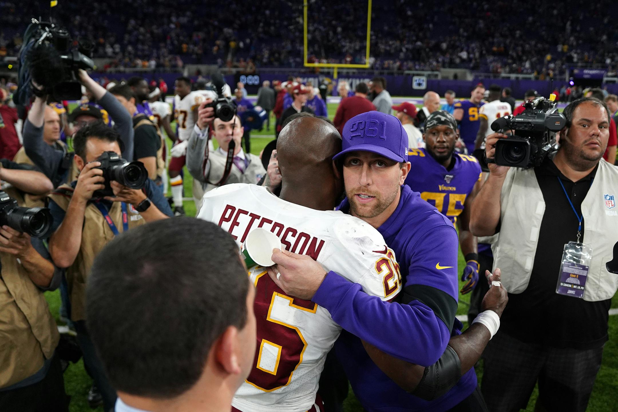Former Minnesota Vikings star Washington Redskins running back Adrian Peterson (26) was greeted by Minnesota Vikings wide receiver Adam Thielen (19) after the game. ] ANTHONY SOUFFLE &#x2022; anthony.souffle@startribune.com The Minnesota Vikings played the Washington Redskins in an NFL game Thursday, Oct. 24, 2019 at U.S. Bank Stadium in Minneapolis.