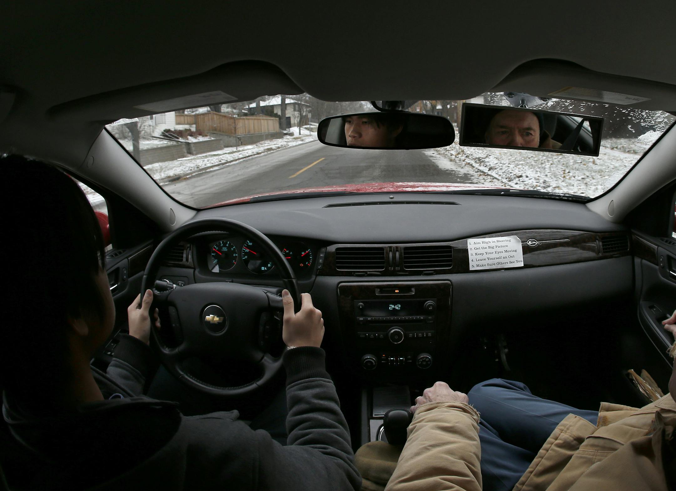 Student driver Soua Xiong, 15, drove with driving instructor John Ertz on Monday afternoon. ] CARLOS GONZALEZ cgonzalez@startribune.com - November 24, 2014, St. Paul, Minn., Highland Park High School, teenage drivers under age 18 will have to spend a minimum of 10 more hours behind the wheel while being supervised by an adult and submit written documentation of those hours under a new law that go into effect on Jan. 1.
