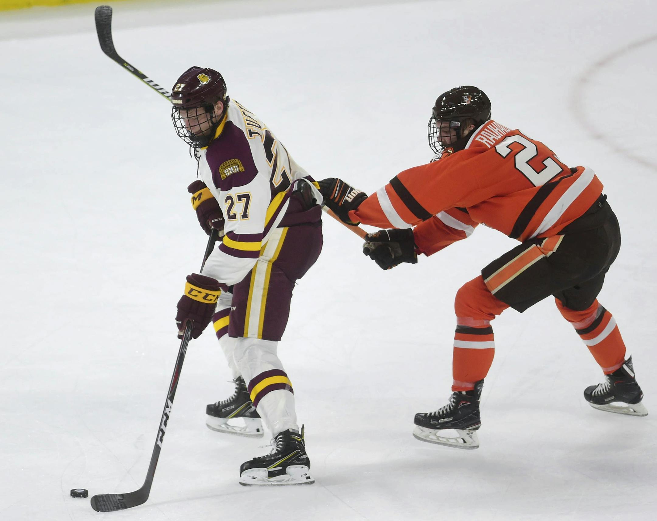 CORRECT TO SEMIFINAL, INSTEAD OF FINAL - Minnesota-Duluth's Riley Tufte, front, controls the puck down the ice as Bowling Green's Alec Rauhauser defends during the NCAA men's Division I hockey tournament Midwest Regional semifinal in Allentown, Pa., Saturday, March 30, 2019. (Amy Shortell/The Morning Call via AP)