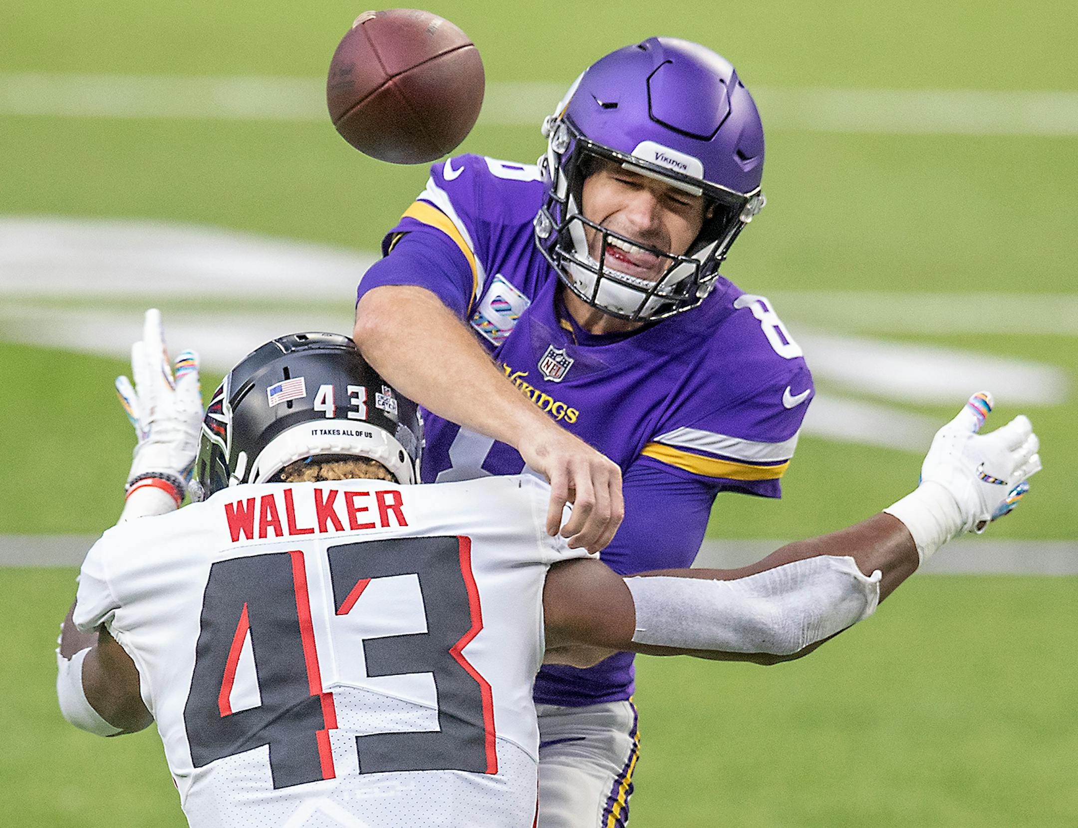 Minnesota Vikings quarterback Kirk Cousins pressured b Atlanta Falcons linebacker Mykal Walker during the second quarter.