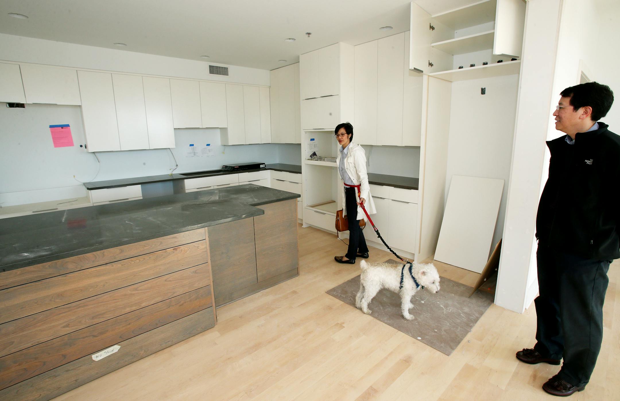 Sharon and Ivan Fiong to a look at their Stonebridge Loft with their dog Bexley which will be completed this summer. ] JOELKOYAMA‚Ä¢jkoyama@startribune Minneapolis, MN on April 21, 2014.