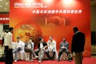 Chinese and African journalists wait to start the opening ceremony of the African Development Bank's annual meetings Wednesday May 16, 2007 in Shangha