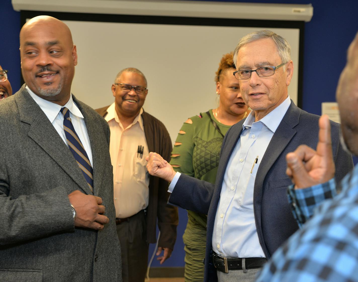 Steve Rothschild (glasses, blue shirt), resigned from an executive post at General Mills in 1991 to address high unemployment among low-income black men through 25-year-old Twin Cities Rise, through personal empowerment and skills training and participating employers. Rise chatted recently with several Rise participants and staff, including Ralph Pruitt (rear, in sweater). a Rise manager and business veteran.