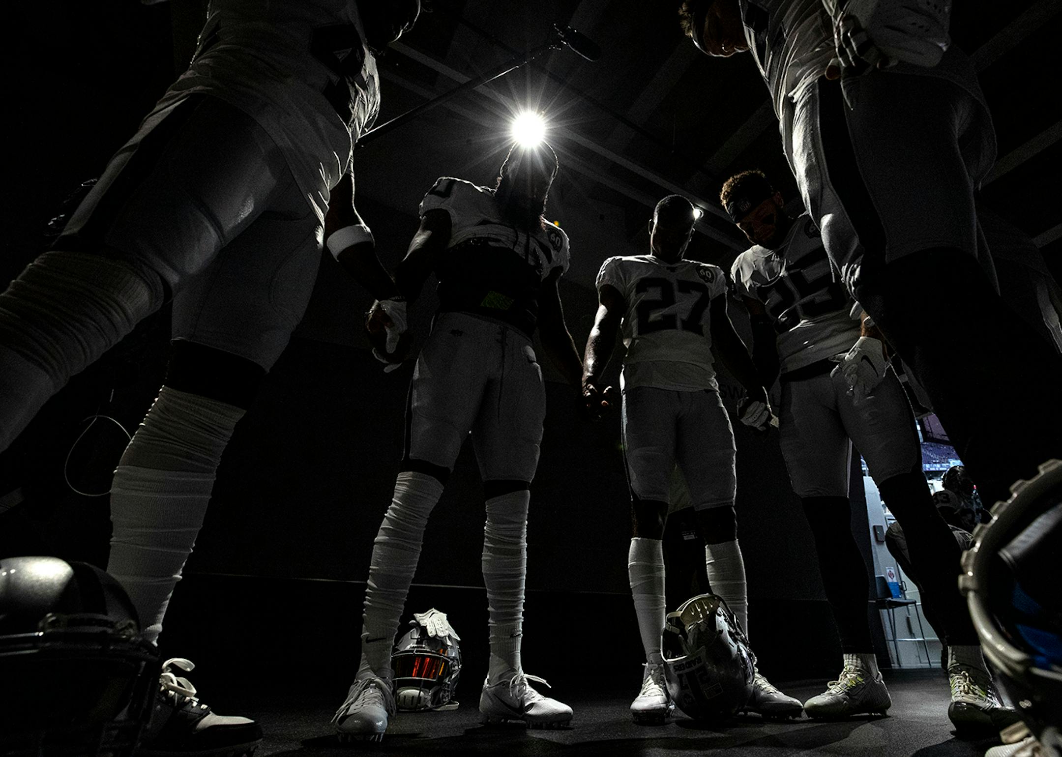 Oakland Raiders players huddled in the tunnel before taking the field for pregame warm ups.