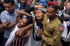 The family of Israeli soldier Sergeant Yosef Dassa mourns during his funeral in Kiryat Ata, Israel, on Sunday. Dassa, 19, was killed during Israel's g