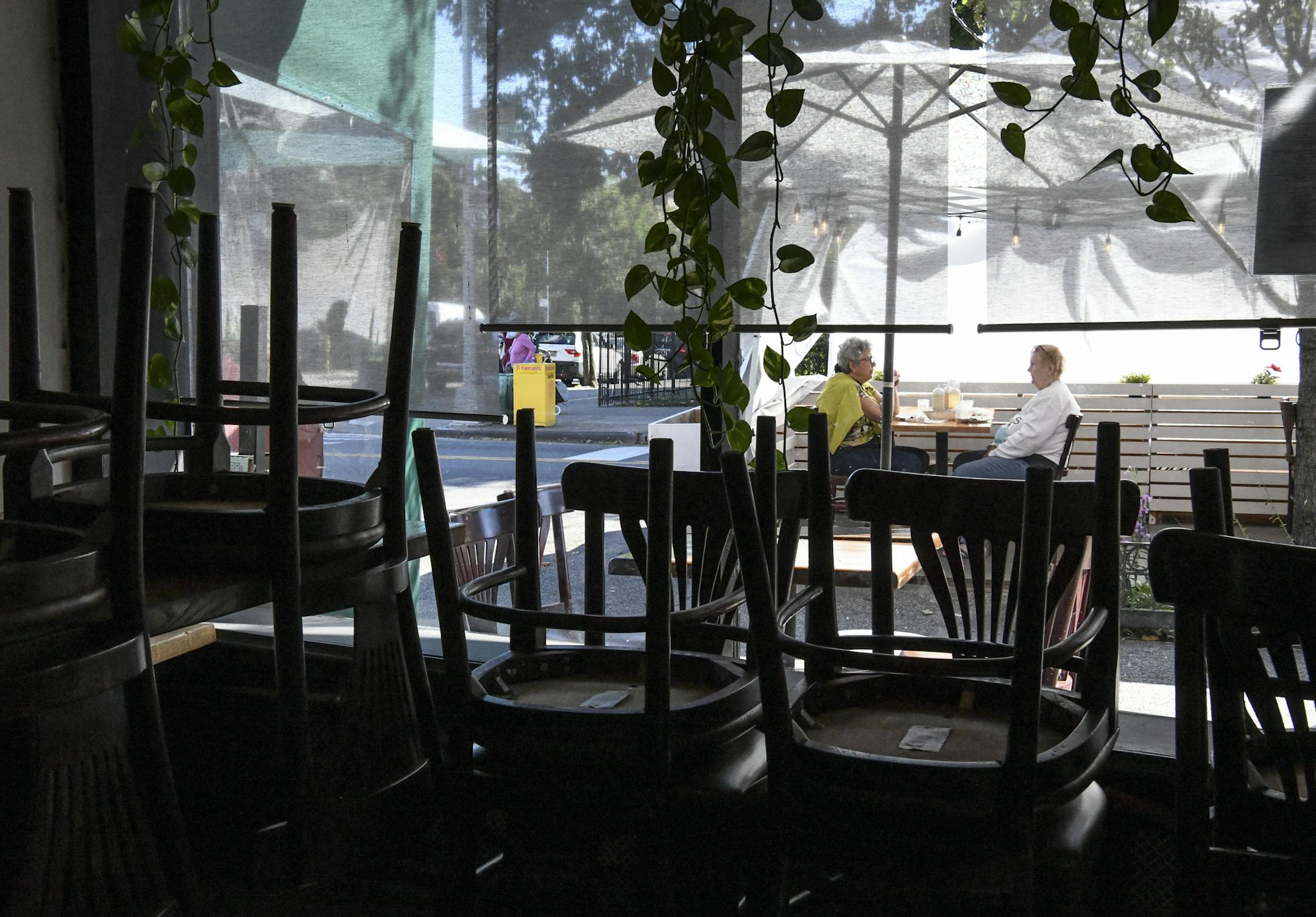 FILE -- Customers eat outside a restaurant in New York, Sept. 30, 2020. Forced into lockdown mode by the pandemic and worried about their futures as the economic recession set in, people scaled back their spending. (Desiree Rios/The New York Times) ORG XMIT: XNYT37
