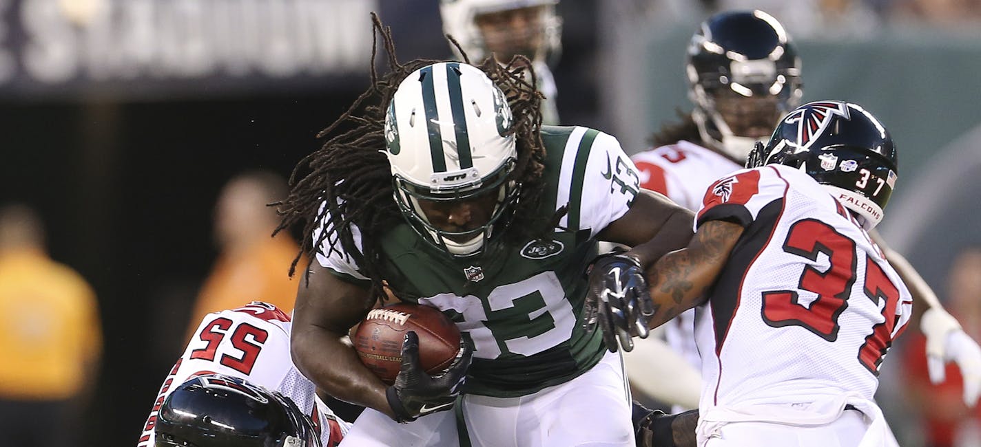 FILE - In this Aug. 21, 2015, file photo, Atlanta Falcons' Paul Worrilow (55) and Ricardo Allen (37) tackle New York Jets' Chris Ivory (33) during the first half of a preseason NFL football game in East Rutherford, N.J. Ivory is a possible breakthrough for the 2015 season. A powerful runner with an upright style that can invite big hits from defenses, if Ivory can stay healthy and determined, he could be a force in the Meadowlands. (AP Photo/Adam Hunger, File)