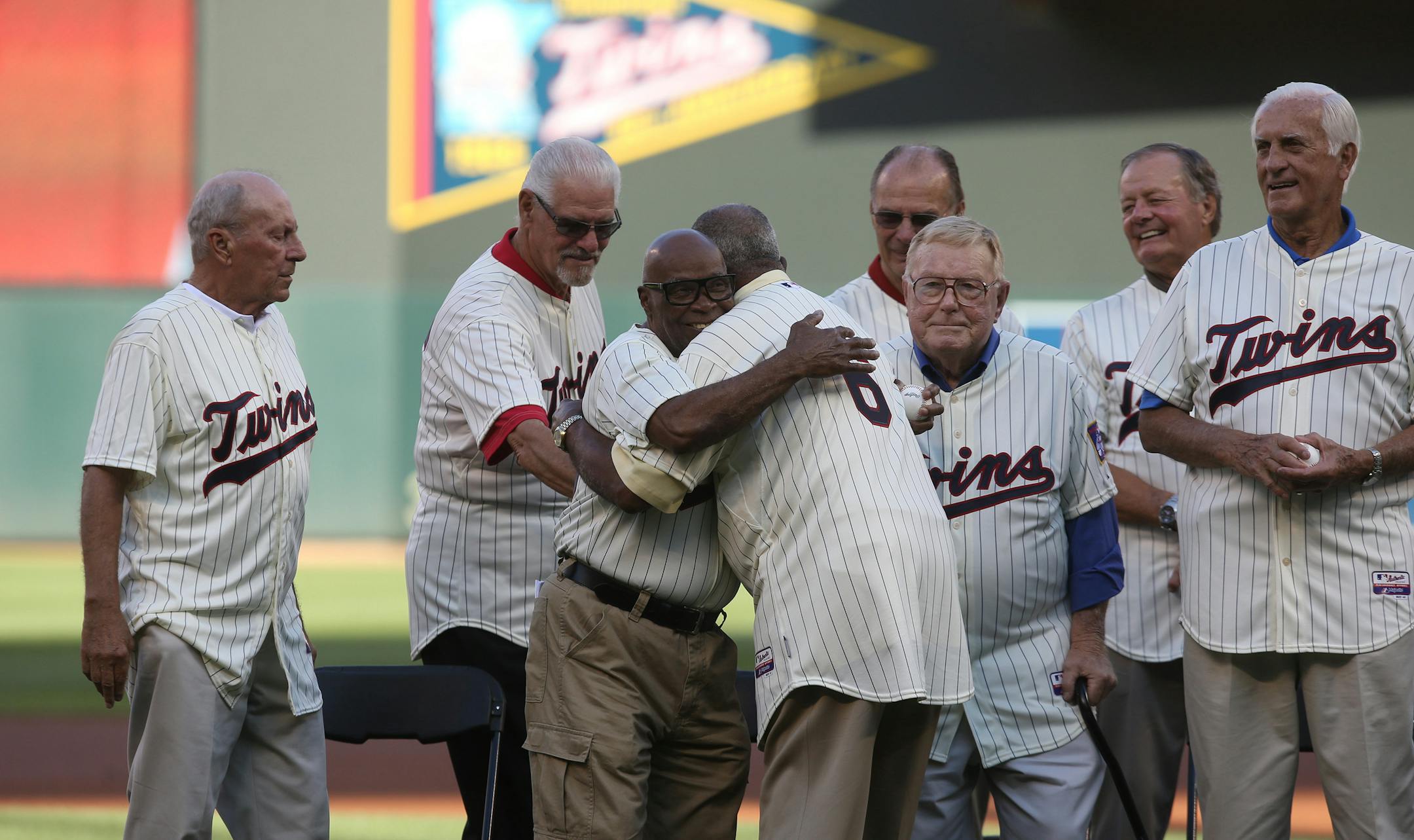 Joe Nossek receives a hug from Tony Oliva during a ceremony honoring the Minnesota Twins' 1965 team before a game against the Seattle Mariners at Target Field in Minneapolis on Saturday, Aug. 1, 2015. (Kyndell Harkness/Minneapolis Star Tribune/TNS) ORG XMIT: 1171733