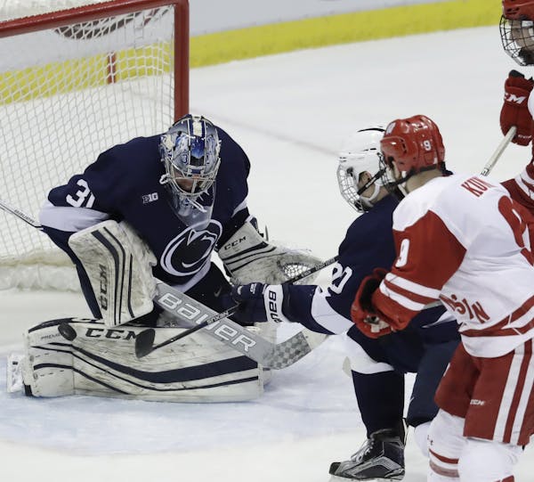 Penn State goalie Peyton Jones (31) deflects a shot during the second period of the final in the Big Ten college hockey tournament, Saturday, March 18