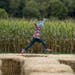 Ruby Pearsall, 7, leapt over hay bails in the kid's maze at Sever's Corn Maze at it's new location in Shakopee, Minn., on Friday, October 4, 2019.