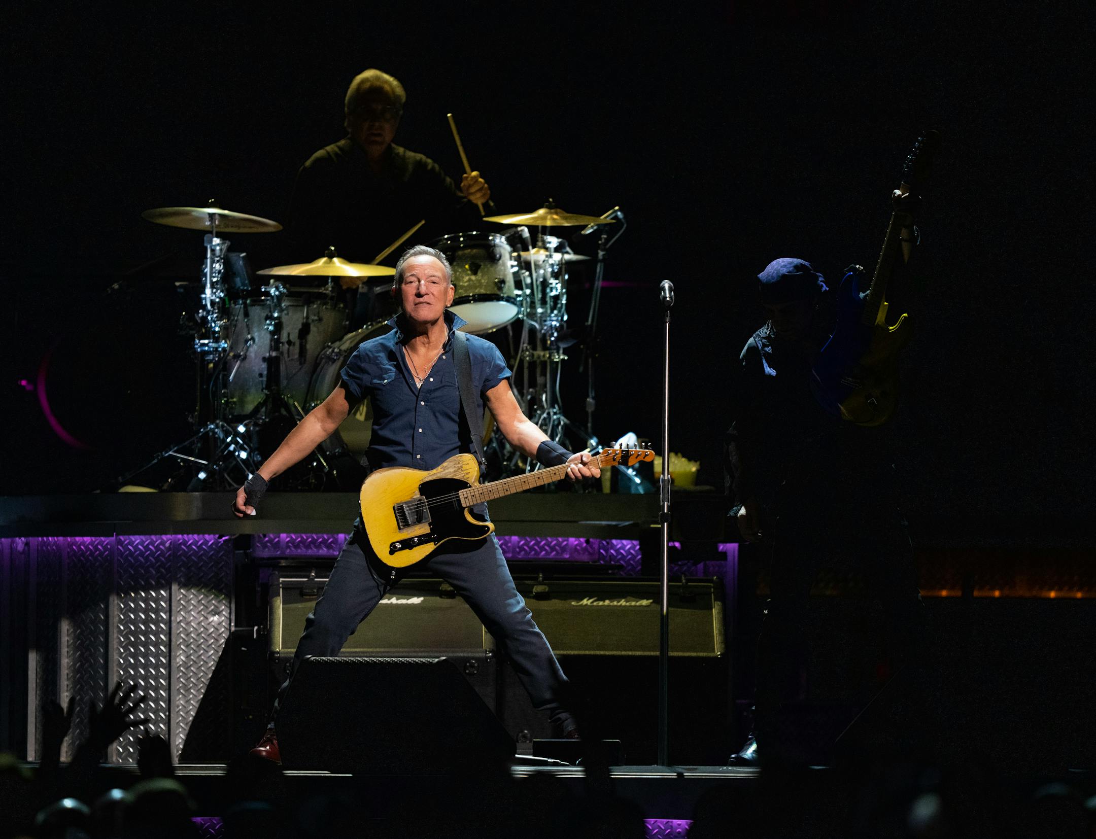 Bruce Springsteen with guitarist Steven Van Zandt and  drummer Max Weinberg early in their set.