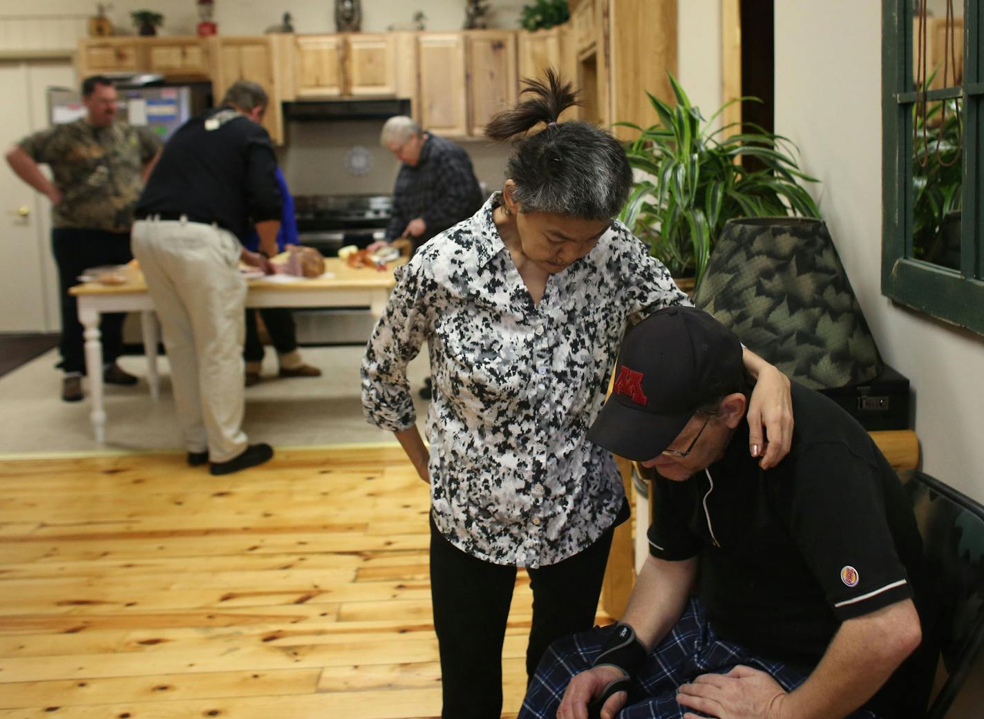 Laura Kwapick hugged her husband Steve before the start of cooking class at Access North, a center for independent living. ] (KYNDELL HARKNESS/STAR TRIBUNE) kyndell.harkness@startribune.com Visited Access North and a food shelter to talk with residents that depend on disability benefits in Walker Min., Tuesday, December 15, 2015. For a growing number of disabled Minnesotans, a little-known federal fund on the brink of insolvency has become a financial lifeline.