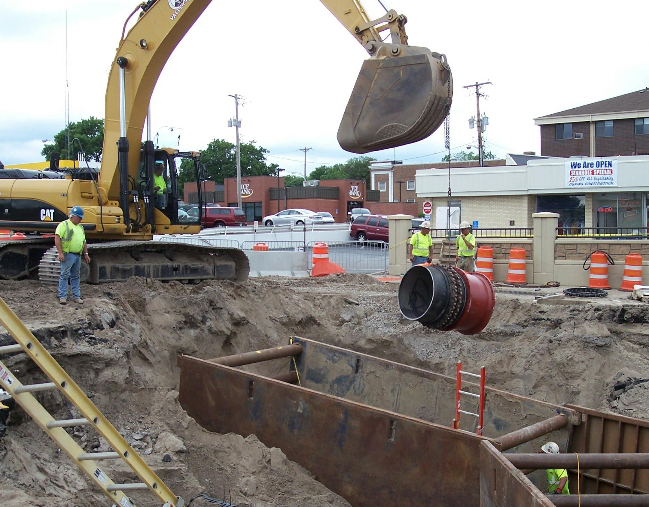 A combination of municipal workers and contractors worked for three weeks to repair the hole left by the water main break in downtown Robbinsdale