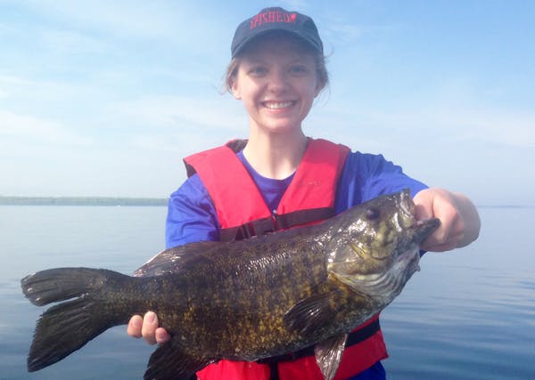 Katie Vorderbruggen, 19, of Champlin, with a dandy bass she caught on Lake Mille Lacs.