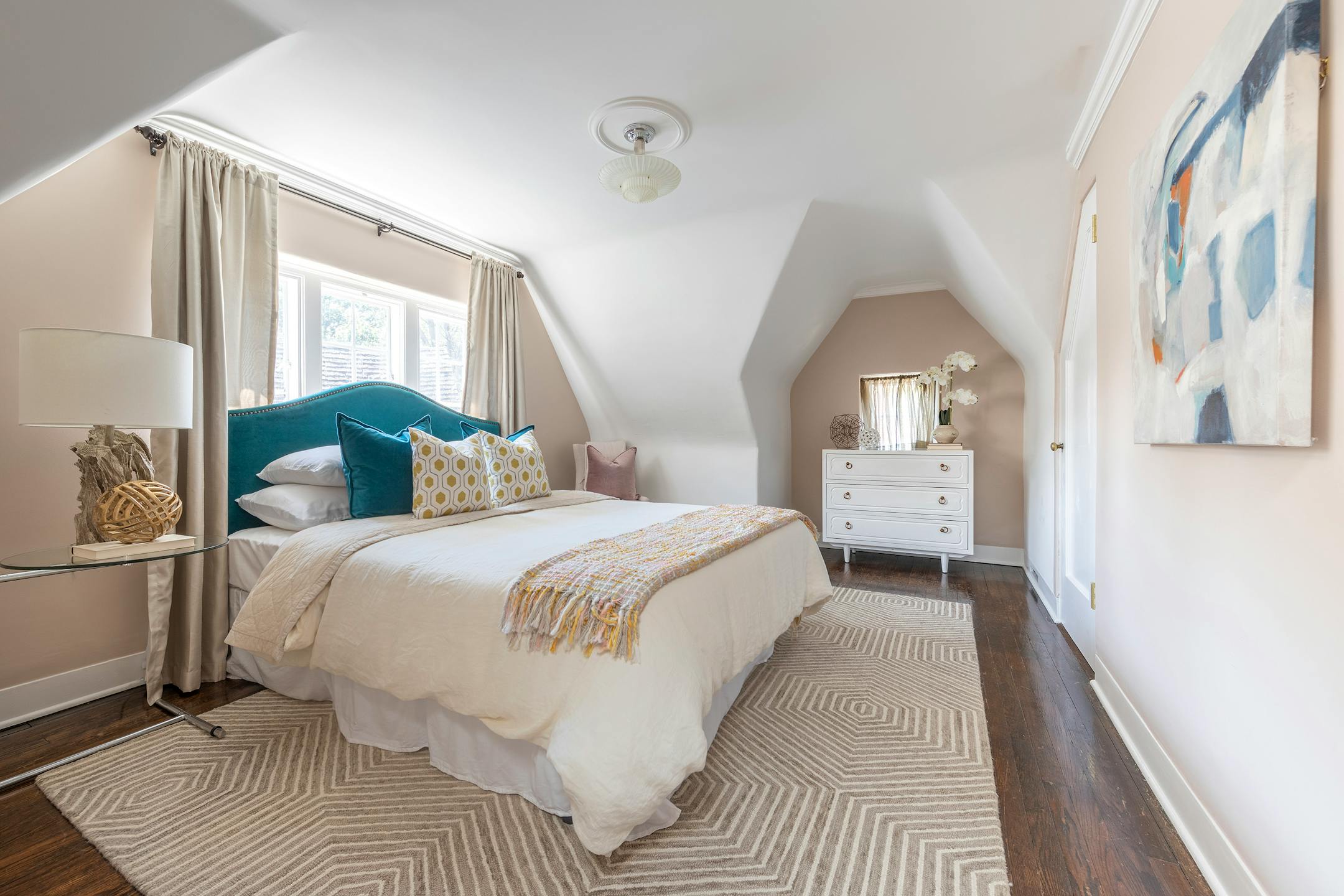 A small bedroom feels open and bright through the use of a neutral color palette. (Design Recipes/TNS)