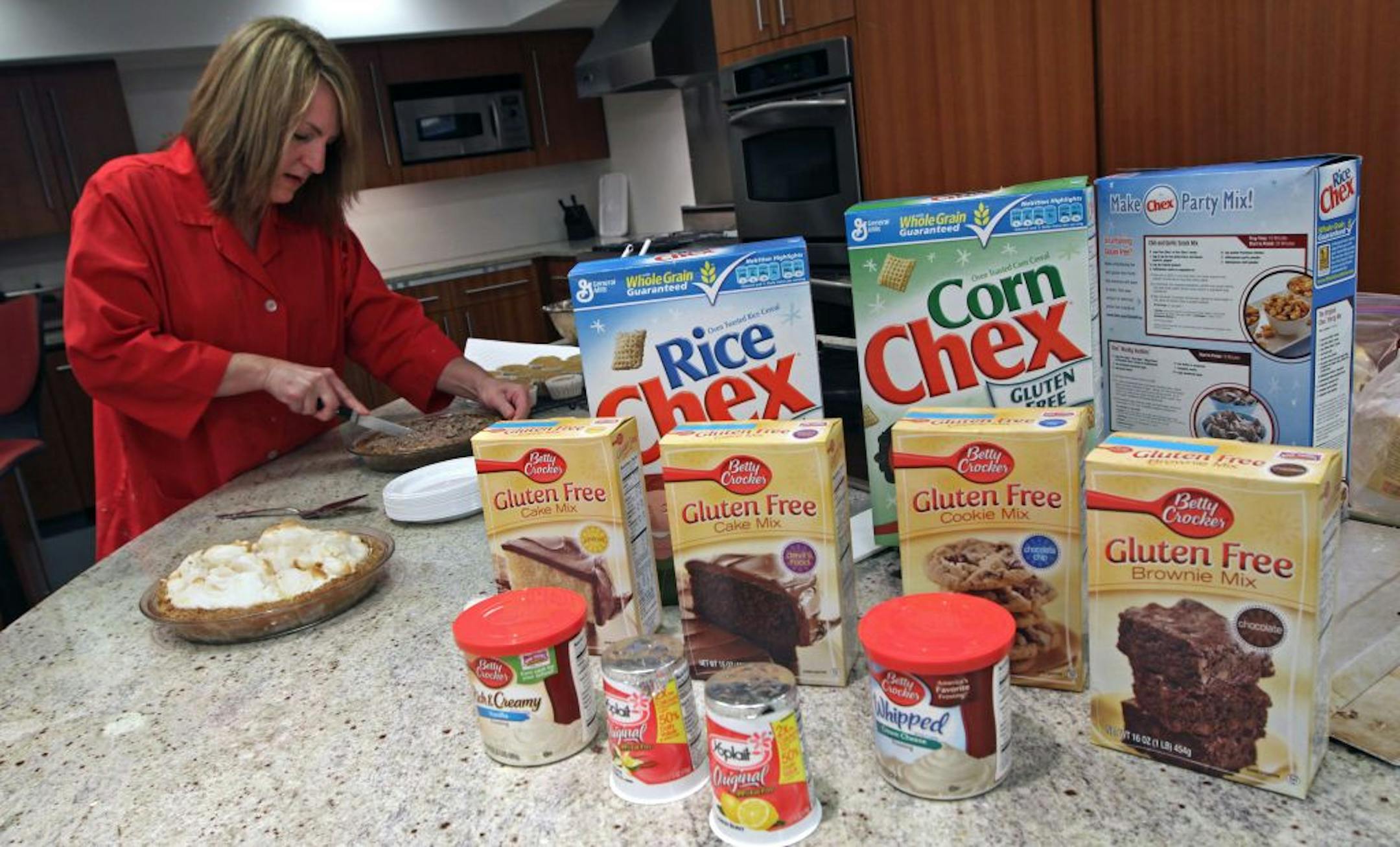 Sherri Field, General Mills Test Kitchen Freelance Home Economist, cut a gluten free creme de menthe pie for serving to a test panel. The General Mills test kitchen was working on gluten free test recipes for an upcoming cook book.