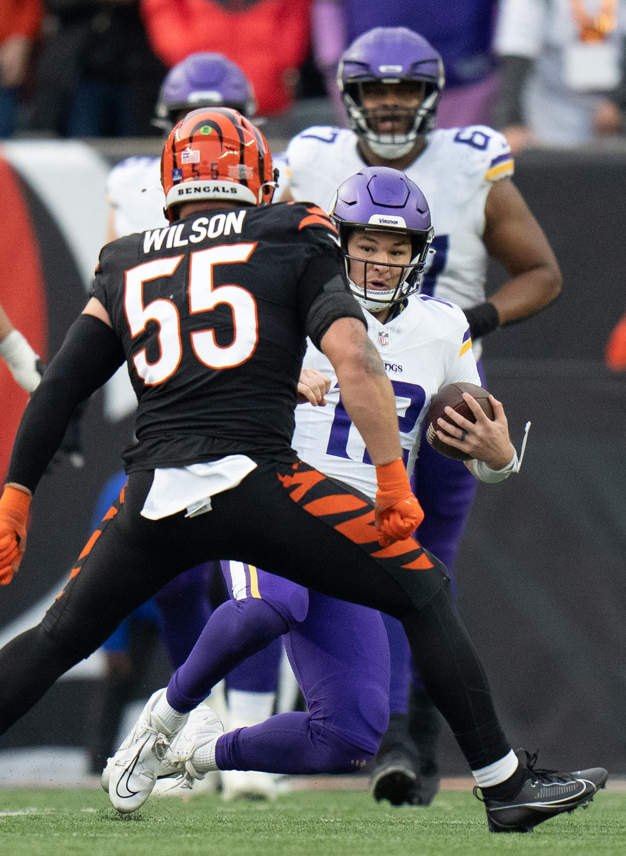Minnesota Vikings quarterback Nick Mullens (12) was short of a first down in the fourth quarter , and was forced to slide by Cincinnati Bengals linebacker Logan Wilson (55) Saturday December ,16 ,2023 in,Cincinnati, OH. ] JERRY HOLT • jerry.holt@startribune.com