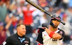Nationals outfielder Eddie Rosario tosses his bat after hitting a go-ahead, two-run homer during the seventh inning against the Blue Jays on Sunday in