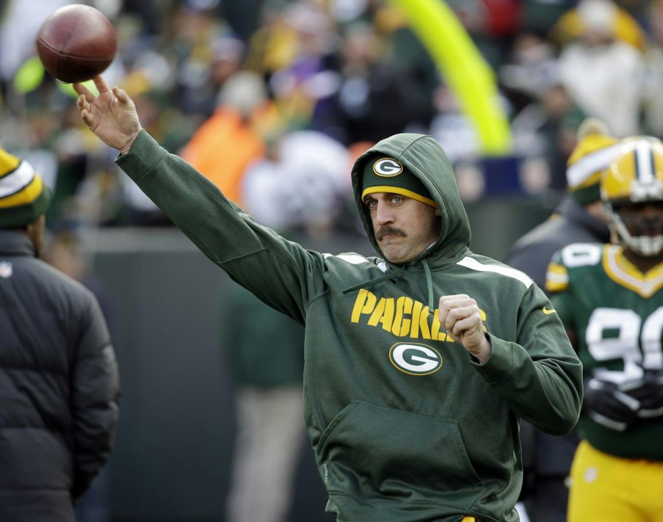 Green Bay Packers' Aaron Rodgers throws before an NFL football game against the Minnesota Vikings Sunday, Nov. 24, 2013, in Green Bay, Wis.