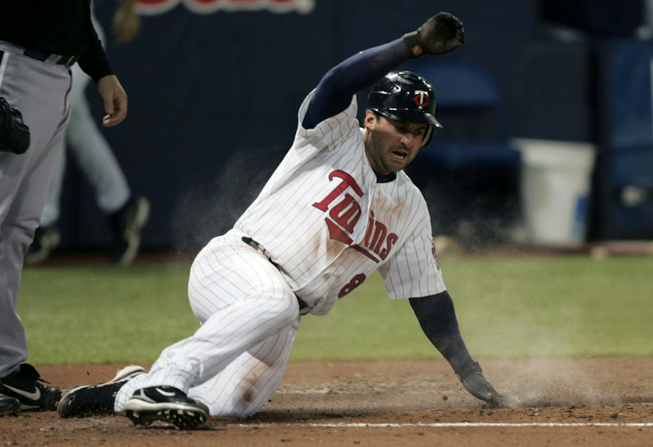 Minnesota's Nick Punto scored during the second inning Wednesday against the White Sox.